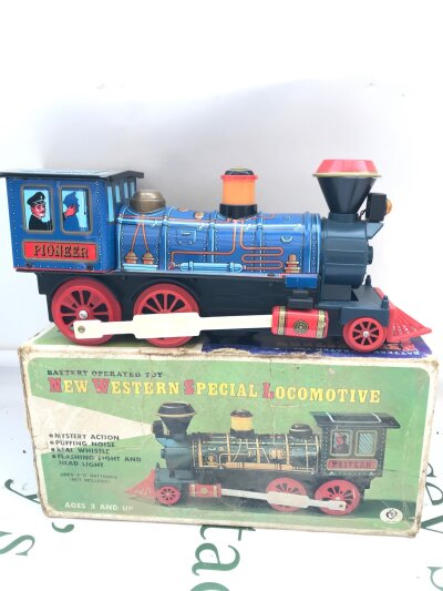 A Boxed Vintage Tinplate Battery Operated New Western Special Locomotive.