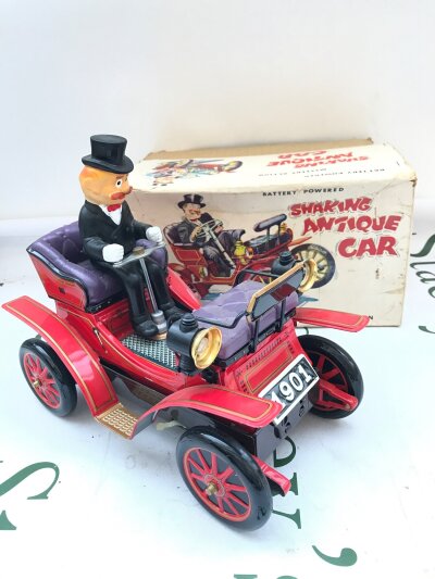 A Boxed Japanese Nomura Cragstan Battery Powered Shaking Antique Car.
