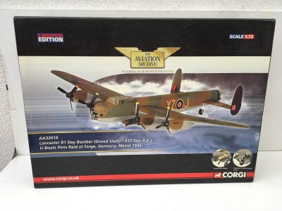 A boxed Corgi Aviation Archive diecast model featuring a Lancaster B1 Day Bomber Grand Slam.  Signed by various 617 Squadron flight crew 8 signatures in total on the aircraft wings.   AA32616 limited edition 1:72 scale.  No reserve