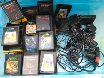 A Atari Video Game System With A Collection Of Games.