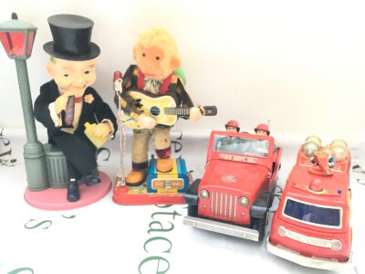 4 Battery Operated Tinplate Toys. A Fire Department Jeep. A Fire Engine, A Rock And Roll Momkey And A Good Time Charlie. No Reserve.