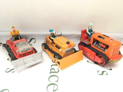 3 X Vintage Battery Operated Tinplate Toys 2 Bulldozers And A Japanese Piston Tractor.