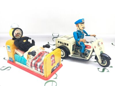 A Japanese Battery Operated Linemar Sleeping Baby Bear And A Nomura Tinplate Police Patrol Tricycle. No Reserve.