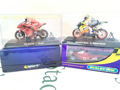 4 X Boxed Scalextric Vehicles A Troy Baylis 12 Bucatini Bike, A Valentino Rossi 46 Repsol Honda, A Renault And Ferrari F1 Cars.