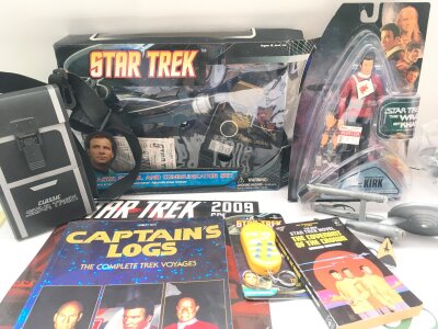 A Collection Of Star Trek Toys/Books Etc. Including A Boxed Phaser Pistol And Communicator.