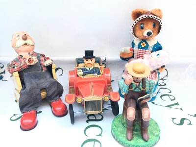 4 X Battery Operated Tinplate Toys. A Smokin Grandpa, A Oldtimer, A Pipe Smoker And A Hungry Baby Bear. No Reserve.