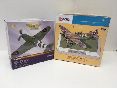 2x boxed Corgi model aircraft featuring Aviation Archive Aa32007 Hawker Hurricane Mk11C D Day 60th anniversary limited edition and  Corgi 50th anniversary AN31919 Supermarine Spitfire Mk1 .    No reserve