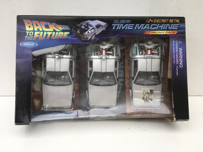 Boxed Welly Back to the Future model Delorean cars in Trilogy pack.  1:24 scale diecast models.  No reserve.