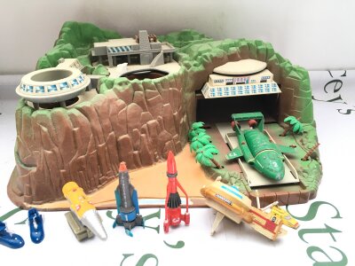 A Carlton Tracy Island, some damage And Playworn toys.