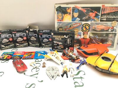 A Collection of Various Toys Including A Early Corgi Chitty Chitty Bang Bang, UFO. Scooby Doo And Metal Posters.