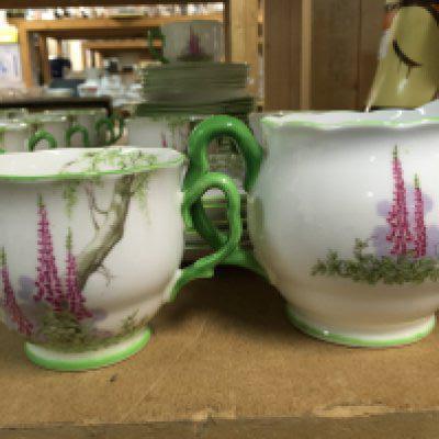 A Royal Albert foxglove tea set comprising twelve cups and saucers side plates dishes and milk jug .
