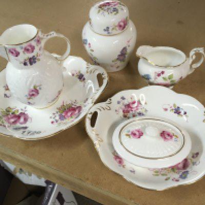 A collection of Coalport decorated with flowers and foliage.including dishes And jugs .