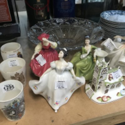 A collection of Royal Doulton lady figures a Coalport Village Church and commemorative beakers including Victorian diamond jubilee. NO RESERVE