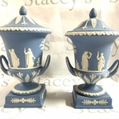 2 Wedgewood Jasperware urns and covers with classical scenes. 31cm/30cm. (68/84) (D)