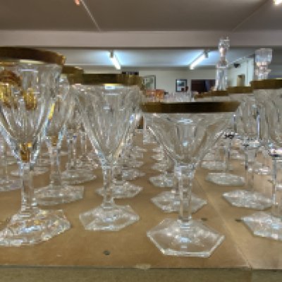 A suite of Moser crystal glassware in the Lady Hamilton pattern. With etched gold borders and flat cut decoration. 4 seats of 6 glasses. (D)