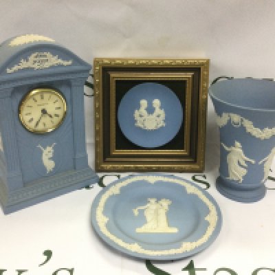 Four Wedgwood jasperware items comprising a mantle clock, vase, dish and a wall mounted commemorative dish (4).
