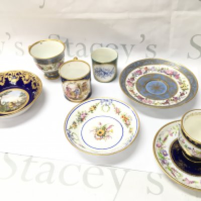 A collection of Sevres ceramics including dishes and cups , one dish dated 1779 decorated with an urn in a country scene painters mark for Jean Chabry & gilders mark for Michelle Barnabie Chauvaux . Some restoration. This lot cannot be posted
