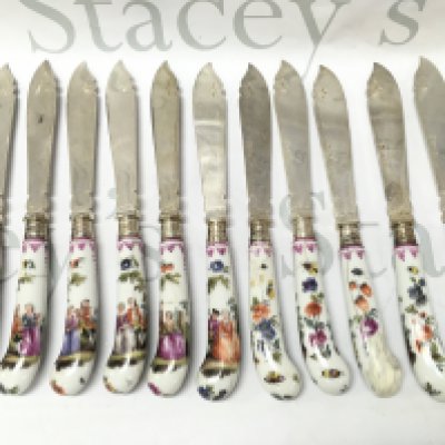 Mid 19th century silver plated knives with ceramic handle design with hand painted decorated with classical style figures and with the other side flowers and insects. Damaged and restored. This lot cannot be posted