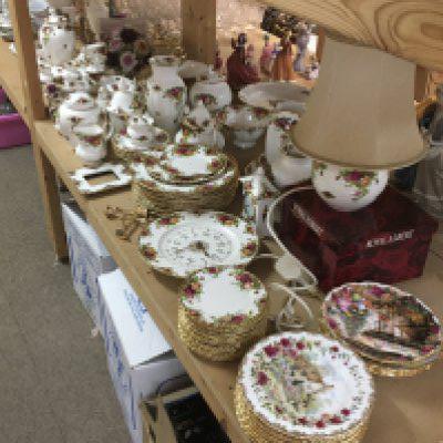 A collection of Royal Albert Country Rose including cups, saucers, plates, vases, telephone, clock etc. this lot cannot be posted