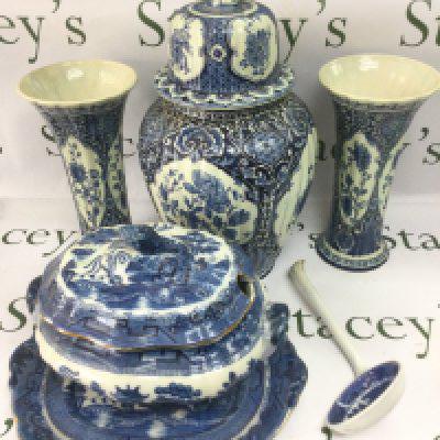 A small collection of blue snd white ceramics including a Delft garniture, approx height 46cm, a tureen and cover with ladle and a pair of modern porcelain vases. Shipping category D.