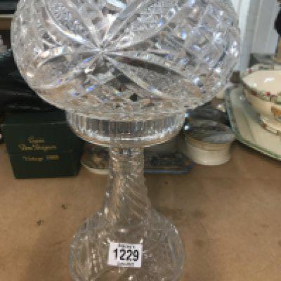 A cut glass side lamp .