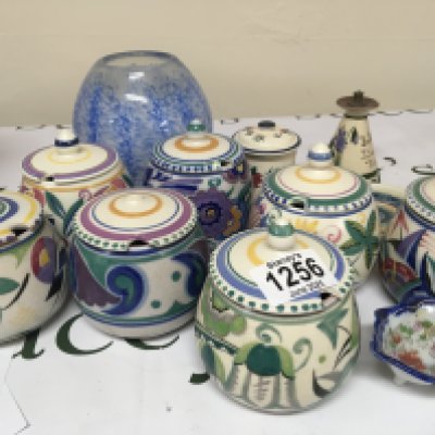 A collection of Poole pottery preserve pots hand painted an art glass vase and other ornaments. Some damage.