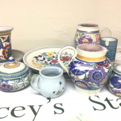 A collection of Poole pottery jugs vases and a dish and a Troika vase (damaged)