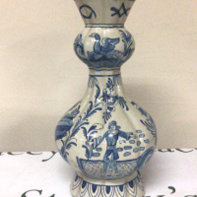 A 19th century Dutch Delft blue and white vase decorated with figures birds and foliage signed base height 33cm