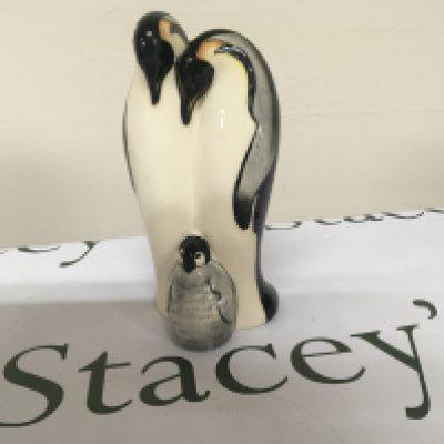 A Moorcroft ceramic ornament in the form of Penguins. dated 2009. Height 18cm no obvious damage.