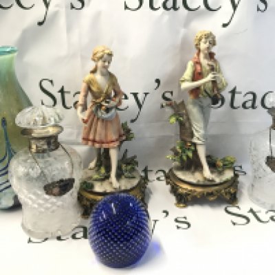 A pair of cut glass silver Hallmarked collared decanters with a pair of classical style Italian porcelain figures (one damaged) an art glass paper weight and a Caithness Khamsin vase