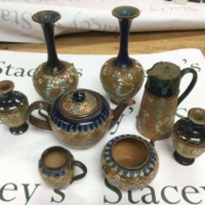 A collection of Doulton Lambeth items comprising a teapot, vases etc. Shipping category D.