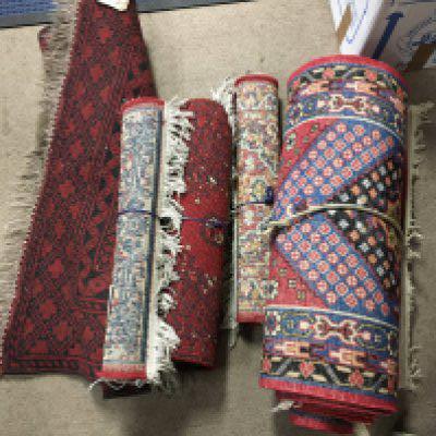 Two small carpets and three rugs.