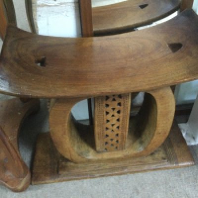 A hardwood carved ethnic stool, approx height 45cm. Shipping category D.