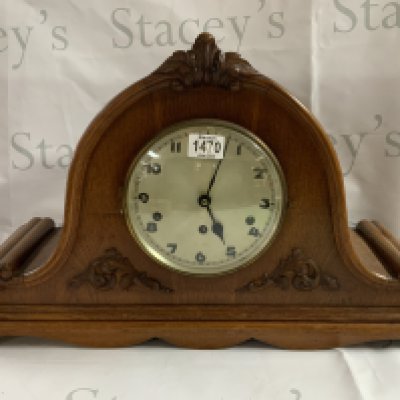 A large oak mantle with Westminster chime. 62cm x 38cm.