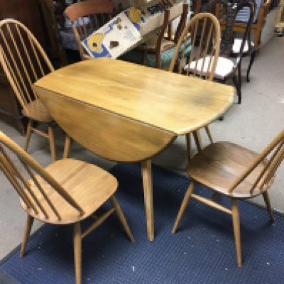 A light Ercole drop leaf table and four chairs 124cm wide 110cm long (fully extended) chairs 95cm tall