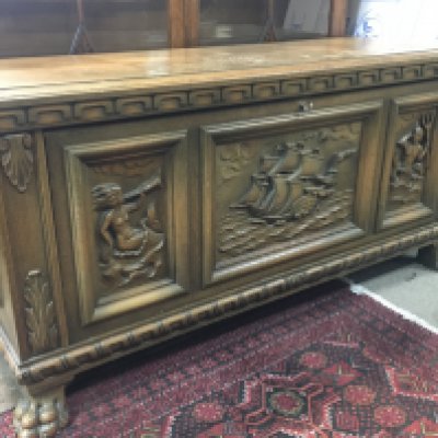A Continental Carved Chest with ship carved design and fitted interior , dimensions 50x128x62cm