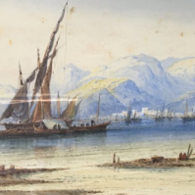 A 19th century watercolour study of moored sailing vessels within a bay with buildings and mountains beyond. Indistinctly signed. The dirt/foxing seems to be on the glass. Frame size 70x43cm. NO RESERVE