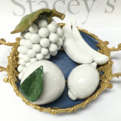 White porcelain fruit on a blue and gilt dish. This lot cannot be posted