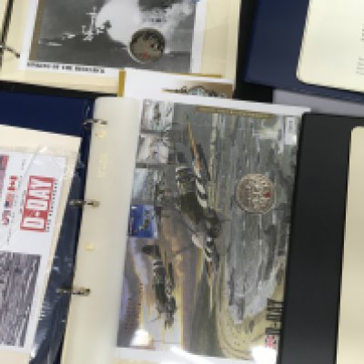 Four albums containing coin covers various.