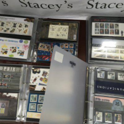 Four albums containing Royal Mail presentation mint stamp packs .