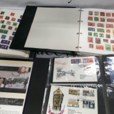 A collection of GB and world stamps together with an album of first day covers .