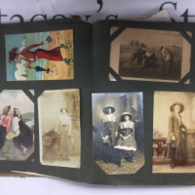 An Edwardian postcard album containing approx 230 plus post cards Shipping category B. NO RESERVE