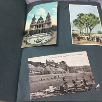 An album of post cards including Edwardian examples.