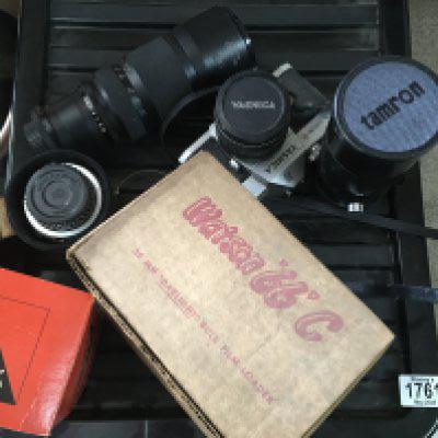 A small collection of cameras lenses and a Yashica camera. NO RESERVE