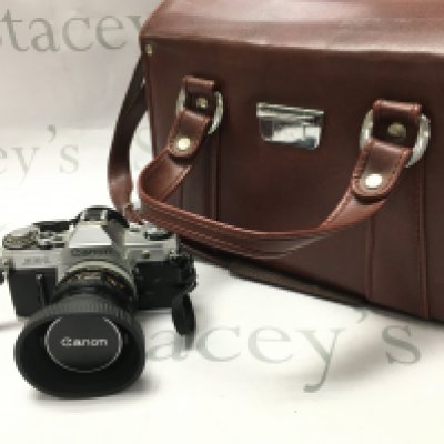 A canon AE-1 camera with extra Tamron 150mm lens , plus case . Postage category C. NO RESERVE