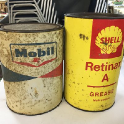 Heavy Mobil full grease can and a Duckhams Admax grease can