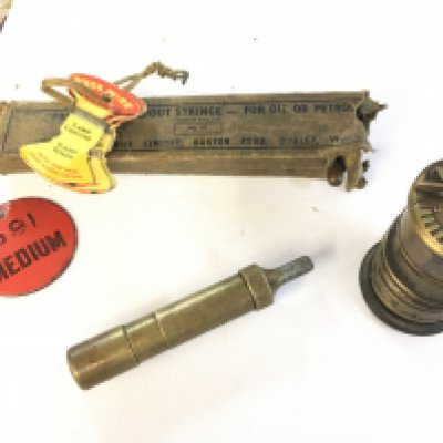 A vintage syringe and other motorist items, postage category B NO RESERVE