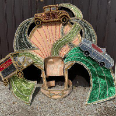 An elaborate Mardi Gras costume the theme of 1970s modern motoring showing 3 classic veichles, worn and made for the New Orleans Mardi Gras Circa 2010, Purchased at Vicky Vines Auction, Houston Texas. Wire framed and sequin covered.