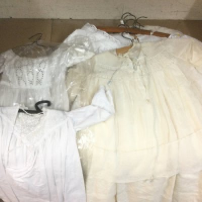 A collection of christening gowns. Shipping category C.