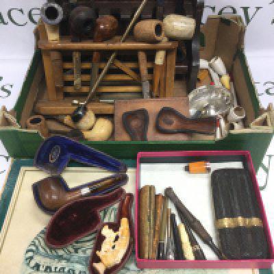 A collection of smoker's pipes and accessories plus a box set of WWF matches (2). Shipping category D.